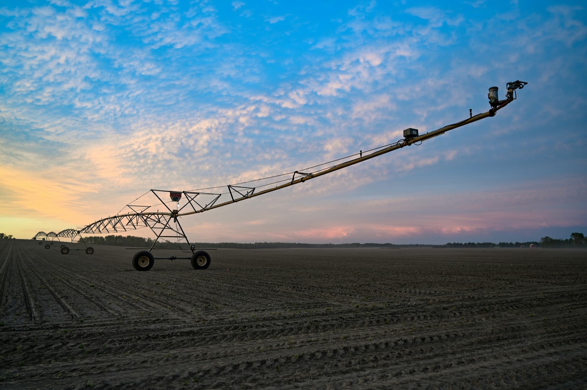 An irrigation pivot at sunset
